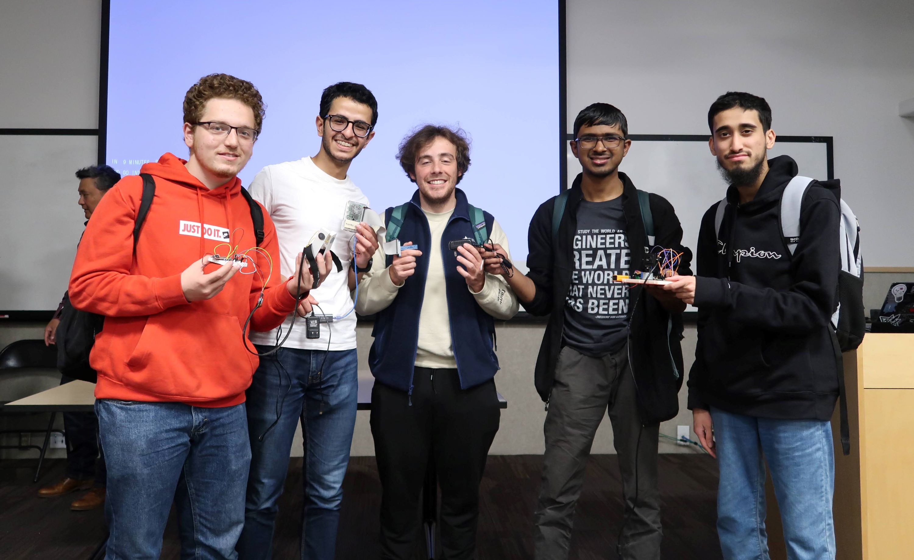 Dominic Orlando with his team after being overall runnerup at HARD Hack 2023, a UCSD student run Hackathon.